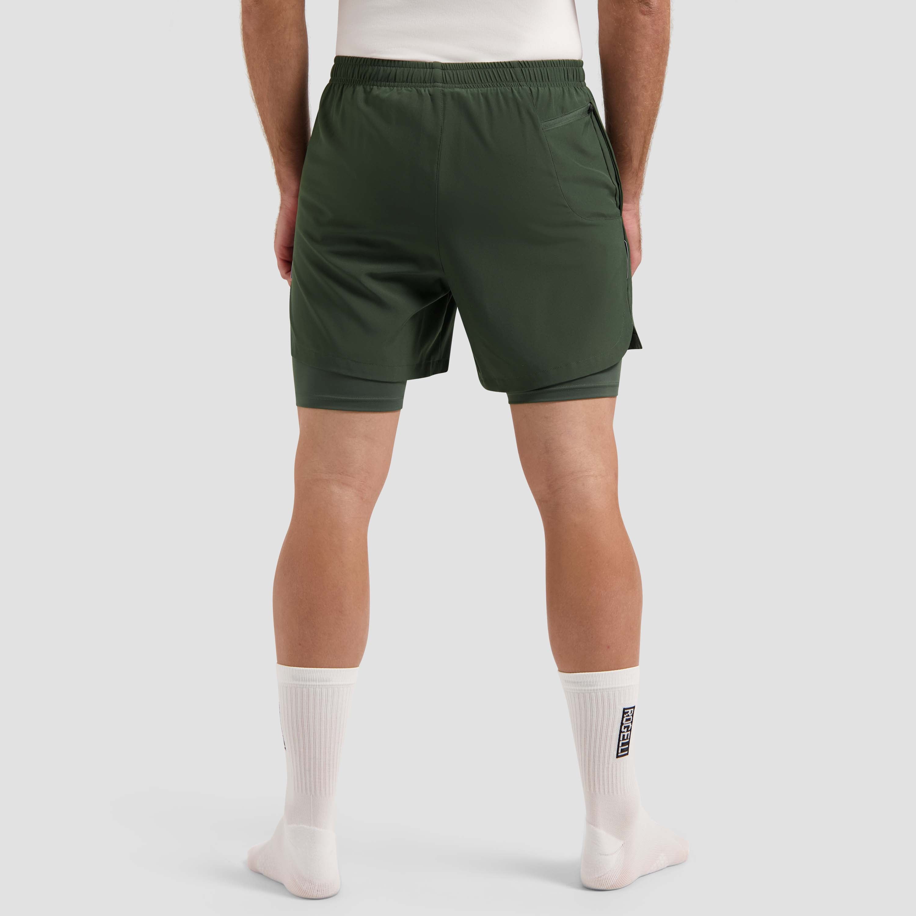 Rogelli Essential 2-en-1 short de course Homme vert usé au dos.