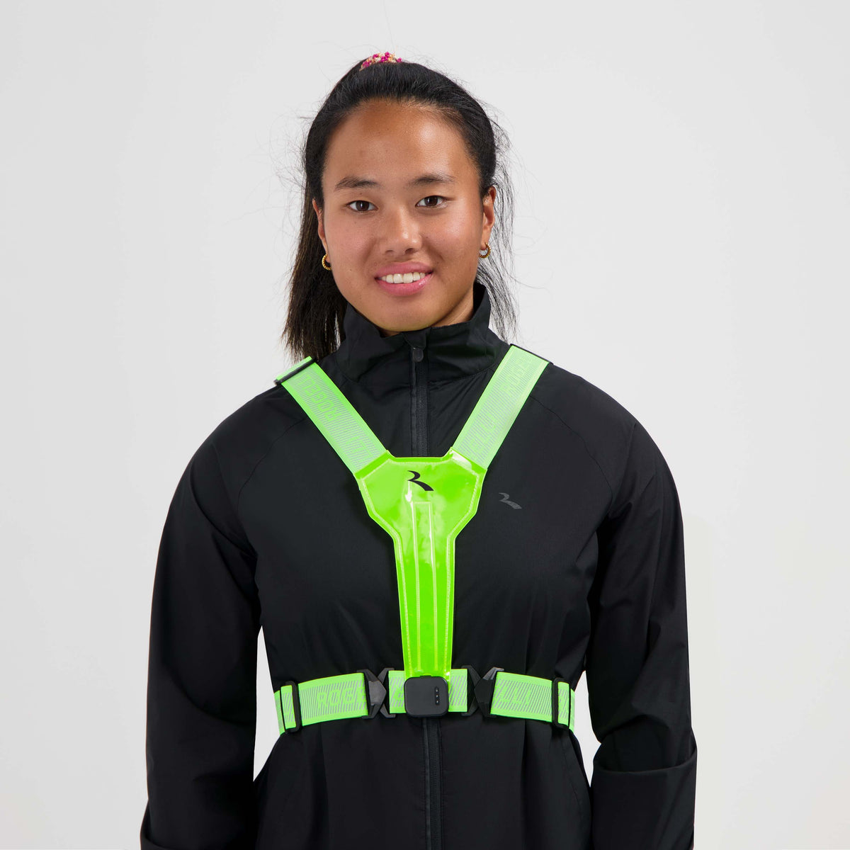 Rogelli Gilet LED USB Éclairage courir Femme fluoro usé devant.