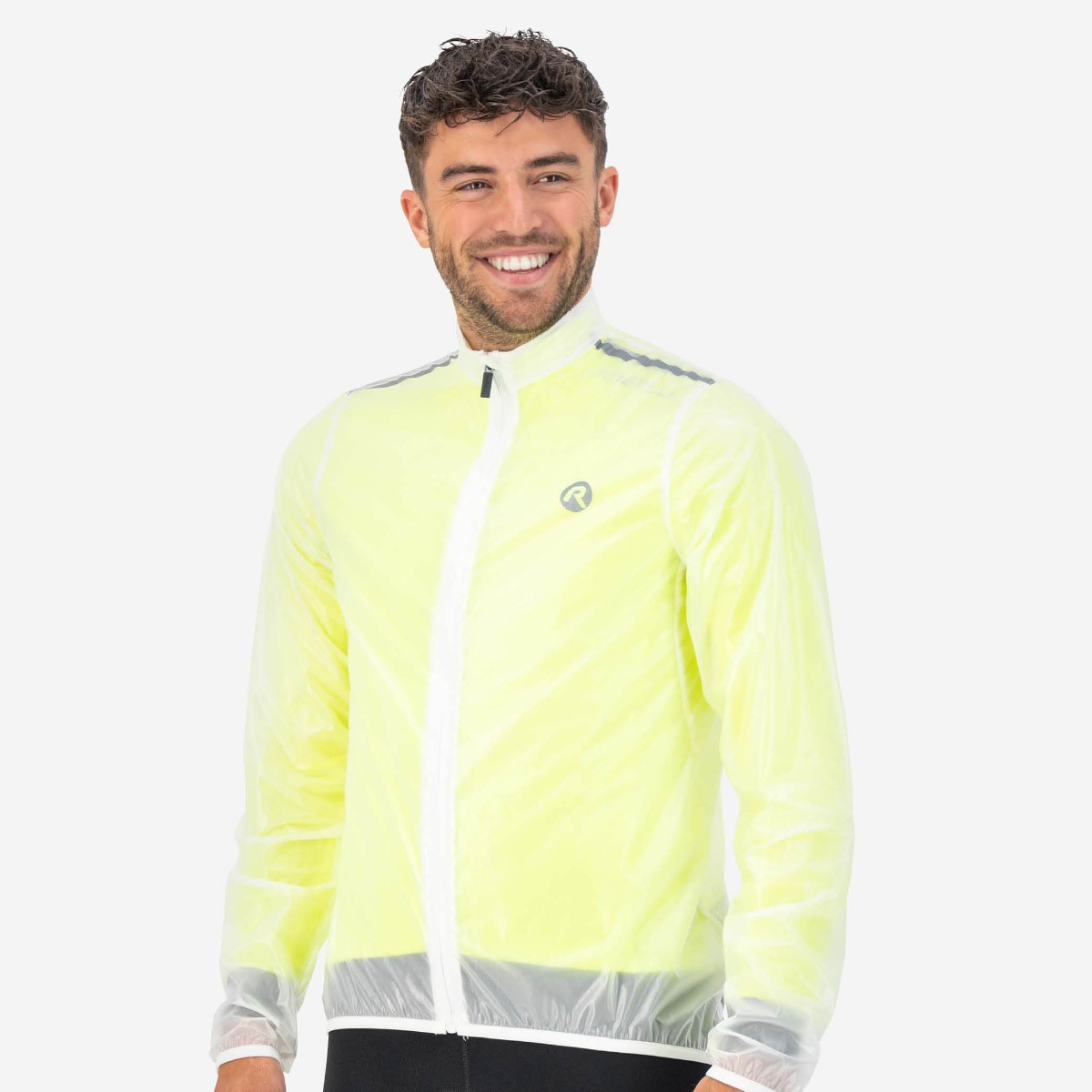Cyclist with Rogelli's Emergency rain jacket, ready for unexpected rain showers
