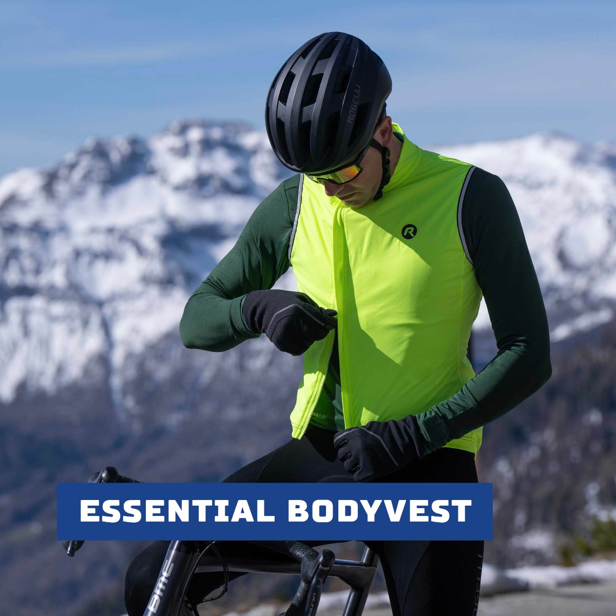 Cyclist zips up his Rogelli body vest with an asymmetric two-way zipper for a perfect fit over the Essential long-sleeve cycling shirt