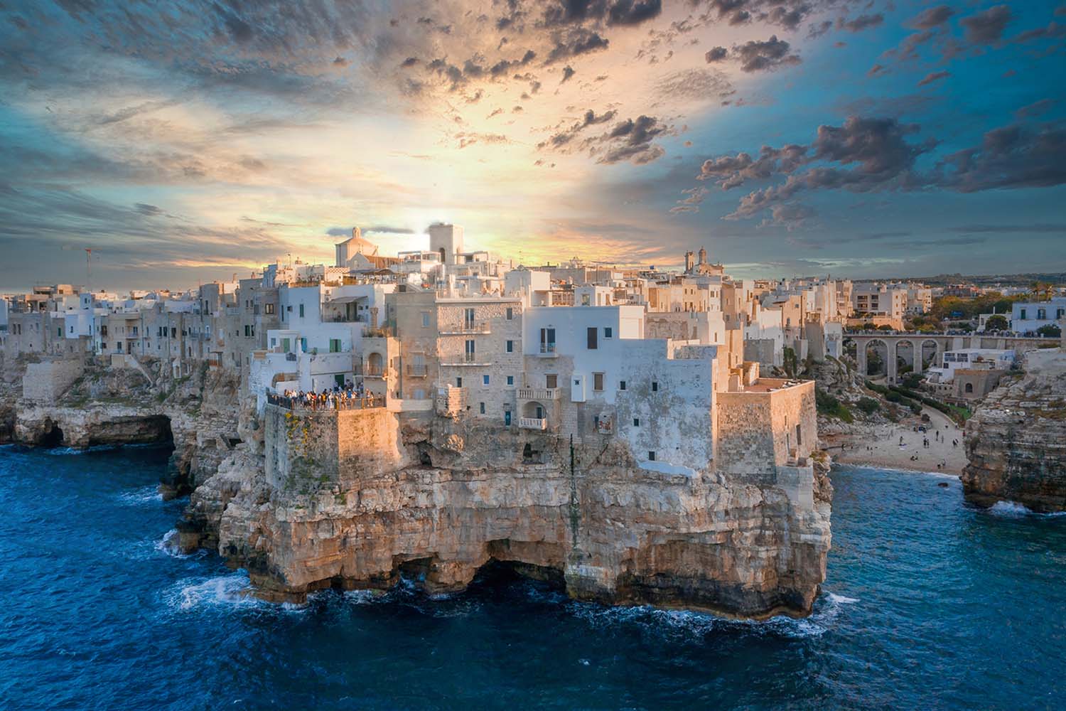 aerial-magnificent-view-polignano-mare-town-gleaming-sunset-italy